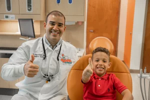 top rated pediatric dentist in edinburg tx smiling with cute patient